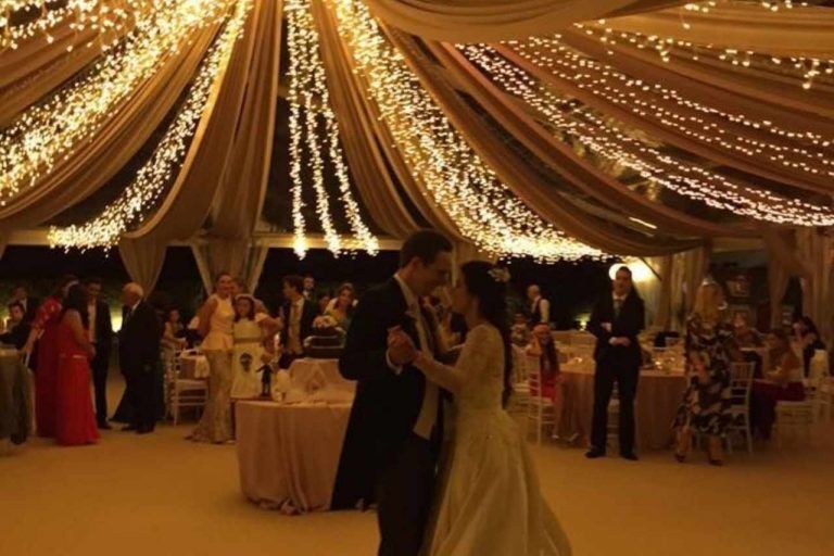 Beautiful party festoon lights illuminating a wedding.